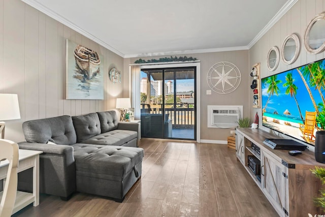 living room with hardwood / wood-style flooring, a wall mounted air conditioner, and crown molding