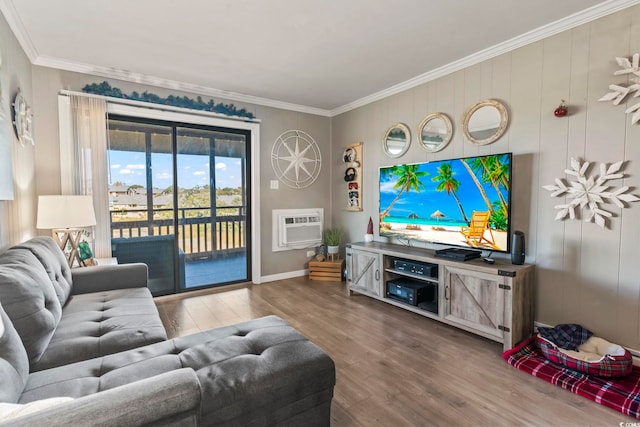 living room featuring crown molding, wood-type flooring, and a wall mounted air conditioner