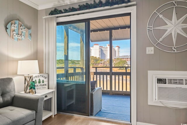 doorway to outside featuring an AC wall unit, crown molding, and hardwood / wood-style flooring