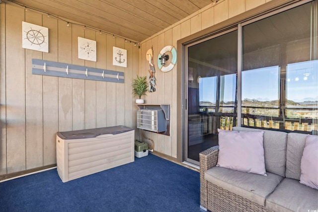 sunroom / solarium featuring wood ceiling