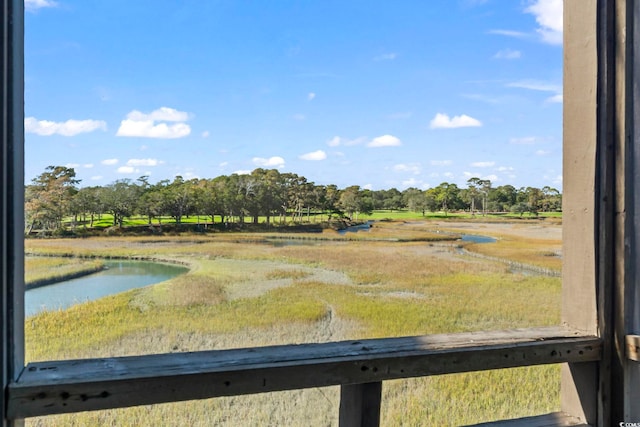 view of yard featuring a water view and a rural view