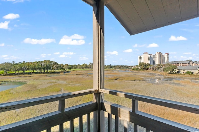 balcony featuring a water view