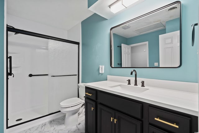 bathroom with vanity, an enclosed shower, and toilet