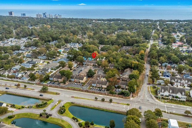 birds eye view of property featuring a water view