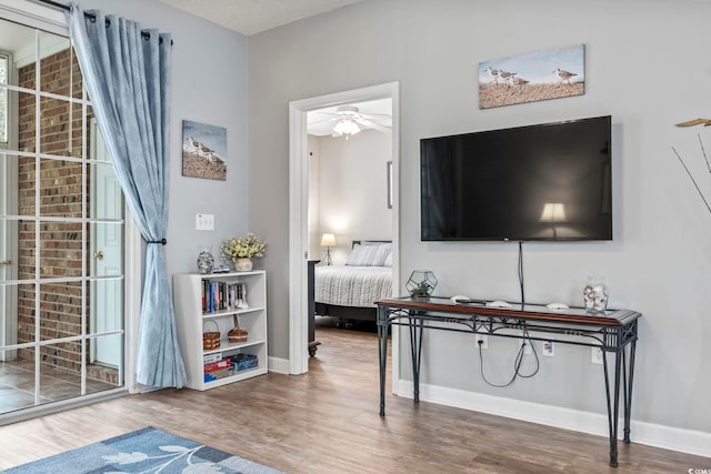 interior space featuring a textured ceiling, hardwood / wood-style flooring, and ceiling fan