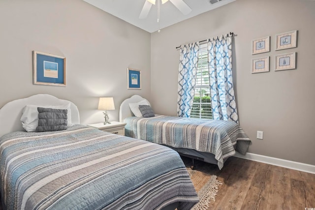 bedroom with hardwood / wood-style flooring and ceiling fan