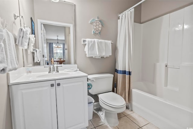 full bathroom featuring vanity, an inviting chandelier, shower / bath combination with curtain, tile patterned flooring, and toilet