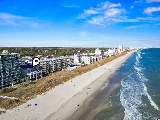 birds eye view of property featuring a water view and a view of the beach