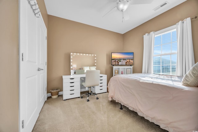 carpeted bedroom with ceiling fan