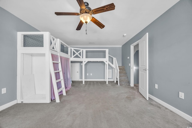 unfurnished bedroom featuring ceiling fan and light colored carpet