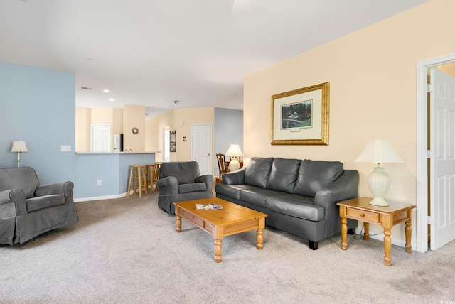 living room featuring carpet and baseboards