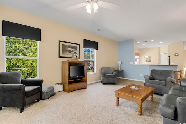 living area with recessed lighting, visible vents, light carpet, ceiling fan, and baseboards