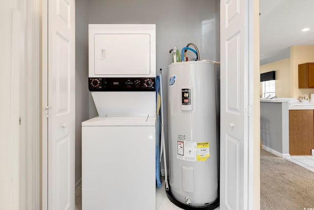 laundry room with electric water heater, light colored carpet, laundry area, stacked washer / dryer, and baseboards