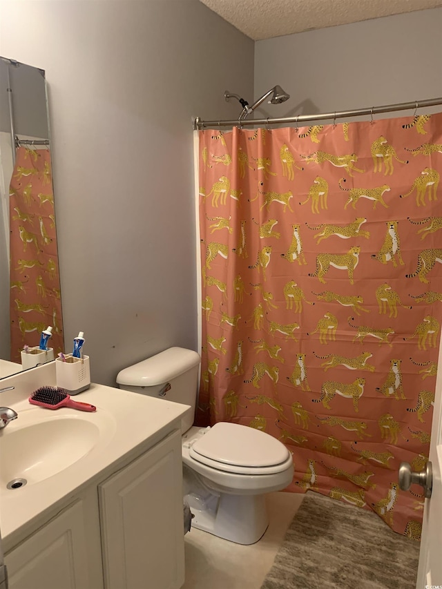 bathroom with a shower with shower curtain, vanity, toilet, and a textured ceiling