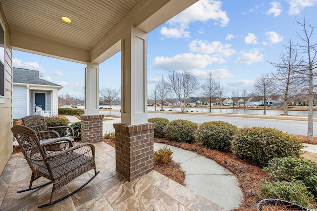 view of patio / terrace featuring a residential view and covered porch