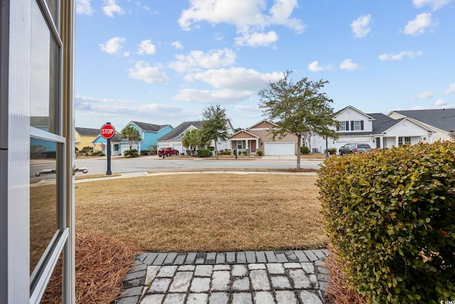 view of yard featuring a residential view