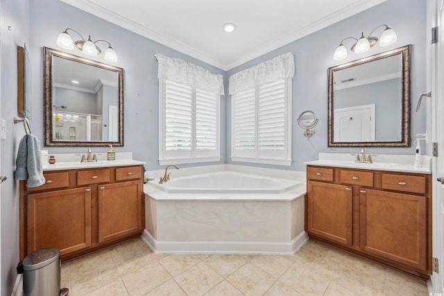 bathroom with a garden tub, two vanities, ornamental molding, a shower stall, and tile patterned floors