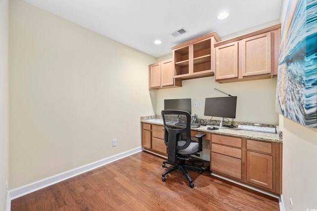 office space with recessed lighting, wood finished floors, visible vents, baseboards, and built in study area