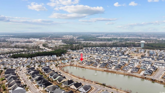 birds eye view of property with a residential view and a water view