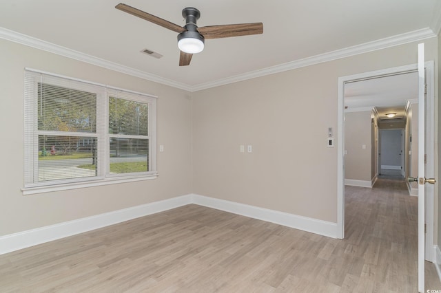 unfurnished room with ornamental molding, ceiling fan, and light wood-type flooring