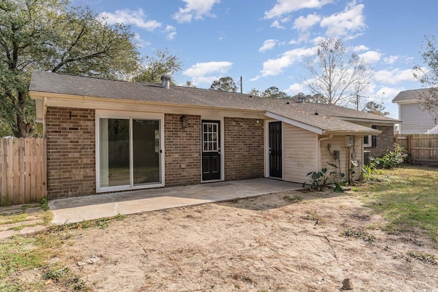 back of house with a patio area