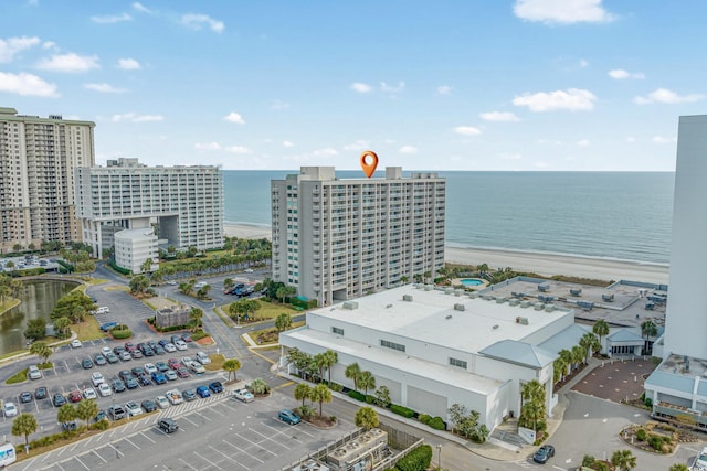 aerial view featuring a view of the beach and a water view