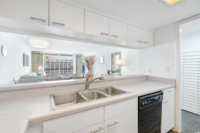 kitchen featuring white cabinets, dishwasher, dark hardwood / wood-style flooring, and sink