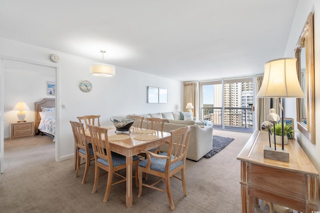 dining area with light colored carpet