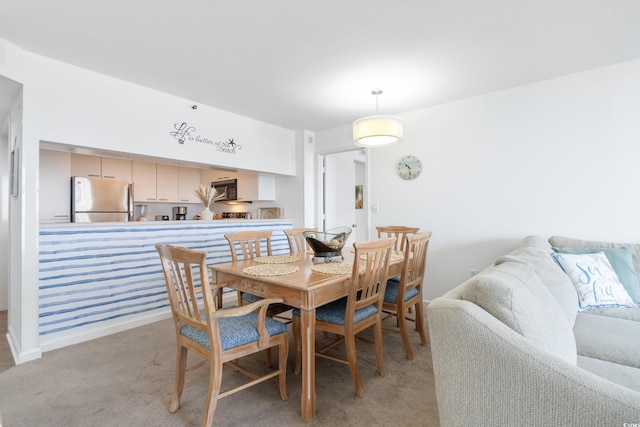 view of carpeted dining space