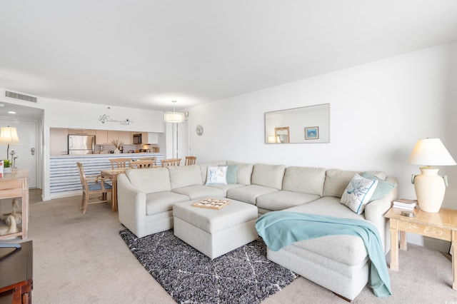 living room with light carpet