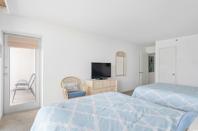 bedroom featuring light colored carpet