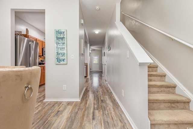 hallway featuring wood-type flooring