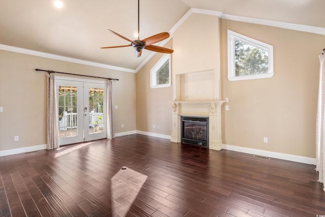 unfurnished living room with dark wood-style flooring, a glass covered fireplace, and crown molding