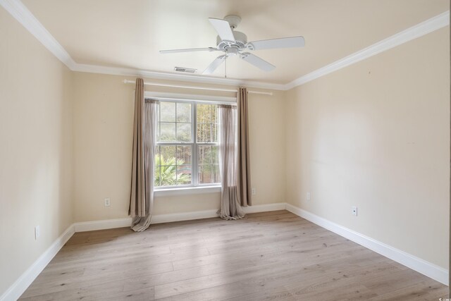 laundry room featuring crown molding, separate washer and dryer, cabinet space, and baseboards