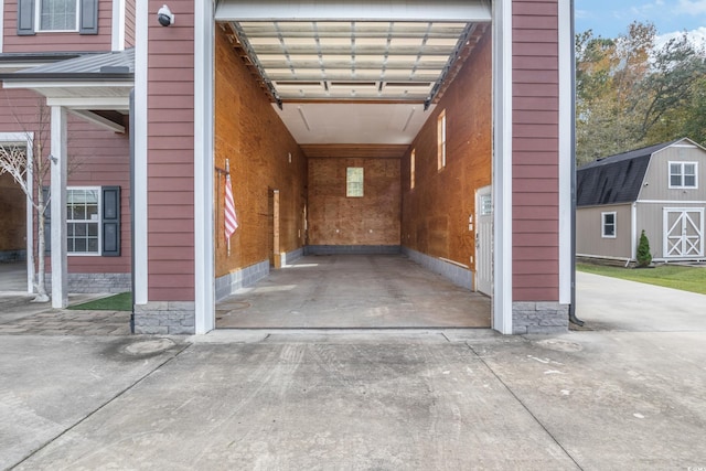 garage featuring concrete driveway