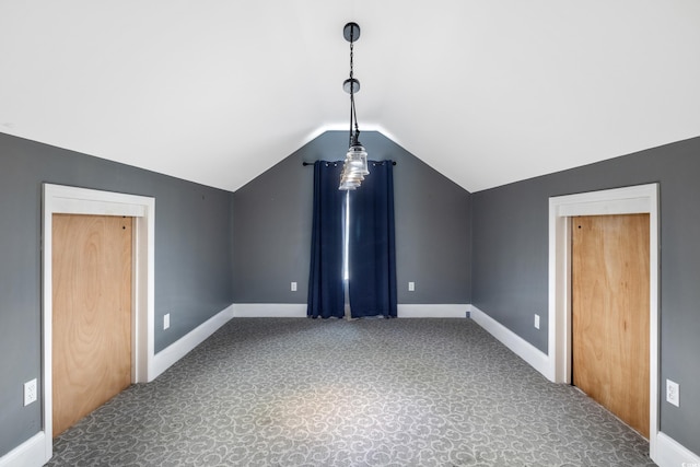 additional living space with lofted ceiling, carpet, and baseboards