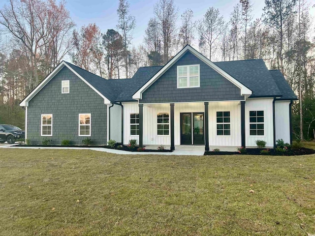 view of front of house featuring a porch and a front yard