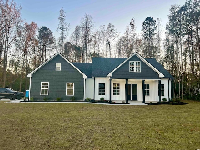 view of front of home featuring a porch and a front lawn