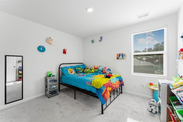 bedroom with light colored carpet