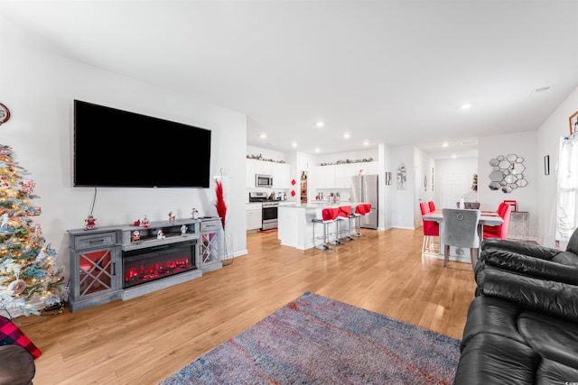 living room featuring light wood-type flooring