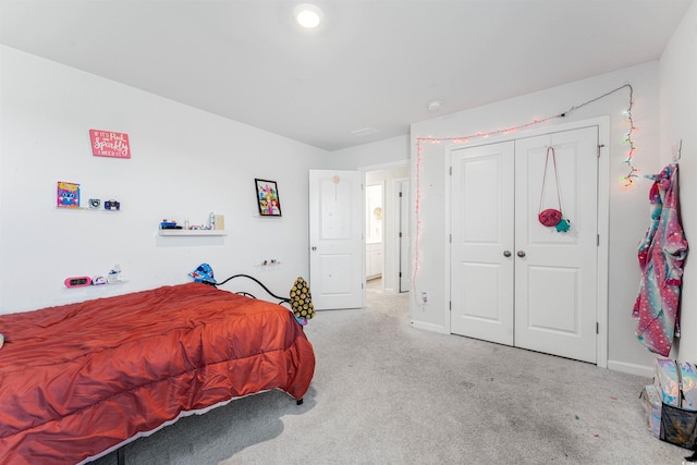 bedroom with light carpet and a closet