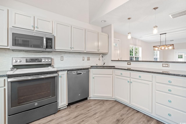 140 Wimbledon Way Unit 140, Murrells Inlet, SC 29576 - kitchen featuring appliances with stainless steel finishes, a sink, tasteful backsplash, and light wood-style flooring