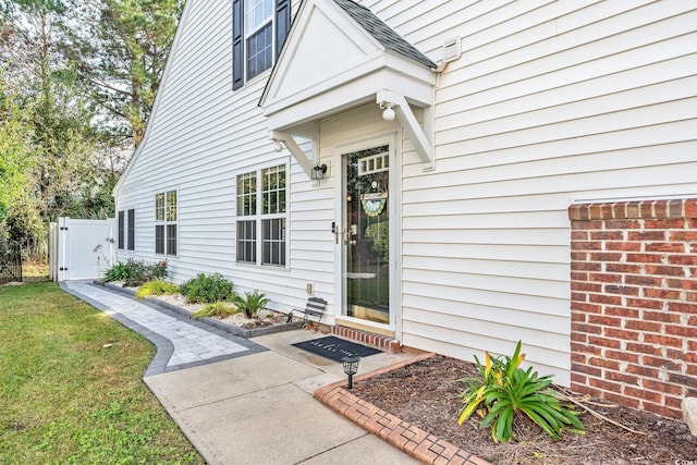 140 Wimbledon Way Unit 140, Murrells Inlet, SC 29576 - property entrance featuring a gate, roof with shingles, and a yard
