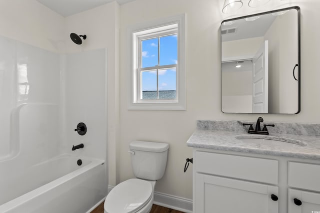 full bathroom featuring shower / tub combination, vanity, and toilet