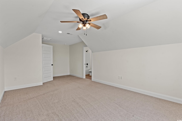 bonus room with light carpet, ceiling fan, and lofted ceiling