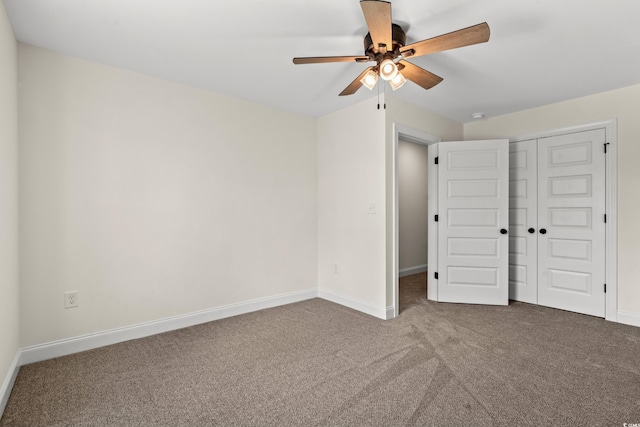 unfurnished bedroom featuring carpet, ceiling fan, and a closet