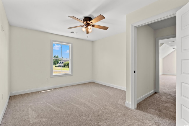 unfurnished room with ceiling fan and light carpet