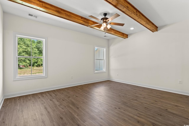 empty room with beam ceiling, ceiling fan, and dark wood-type flooring