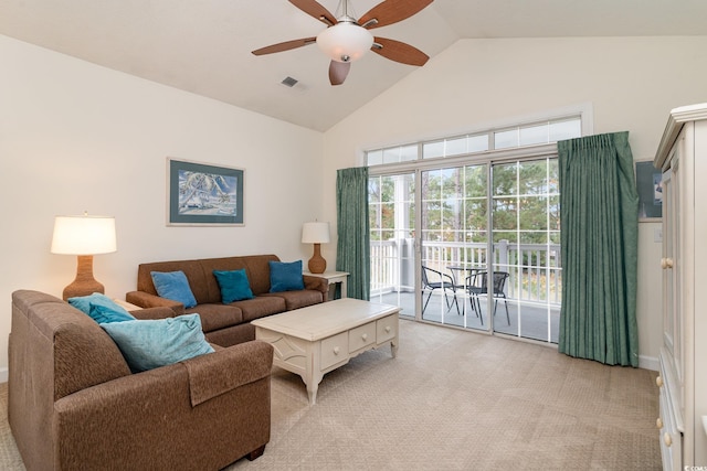 living room featuring ceiling fan, light colored carpet, and lofted ceiling