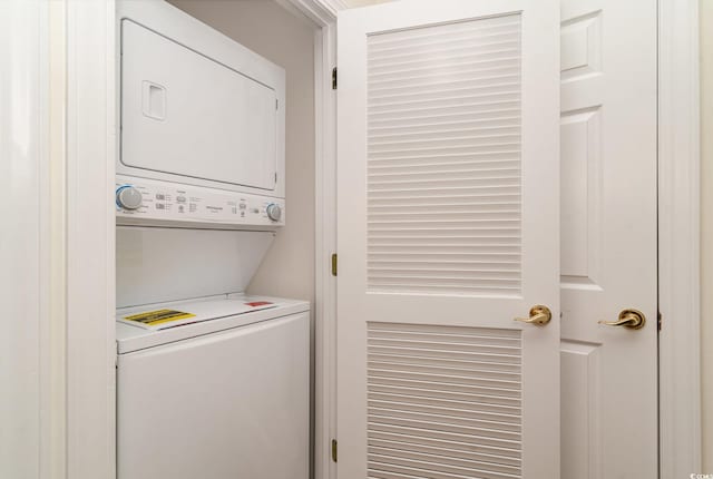 washroom with stacked washer and dryer